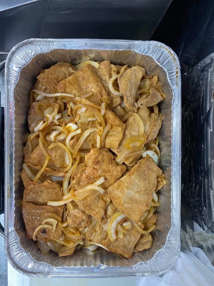 Bisteses de Puerco Encebollados